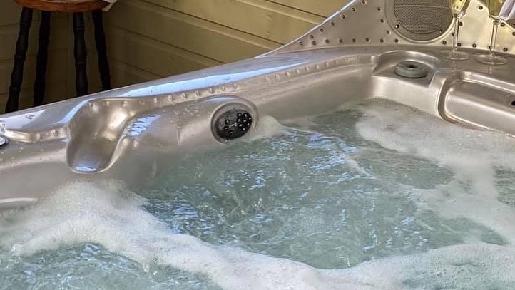 Covered hot tub pavilion with privacy glass and Strangford Lough views at Northern Ireland group accommodation